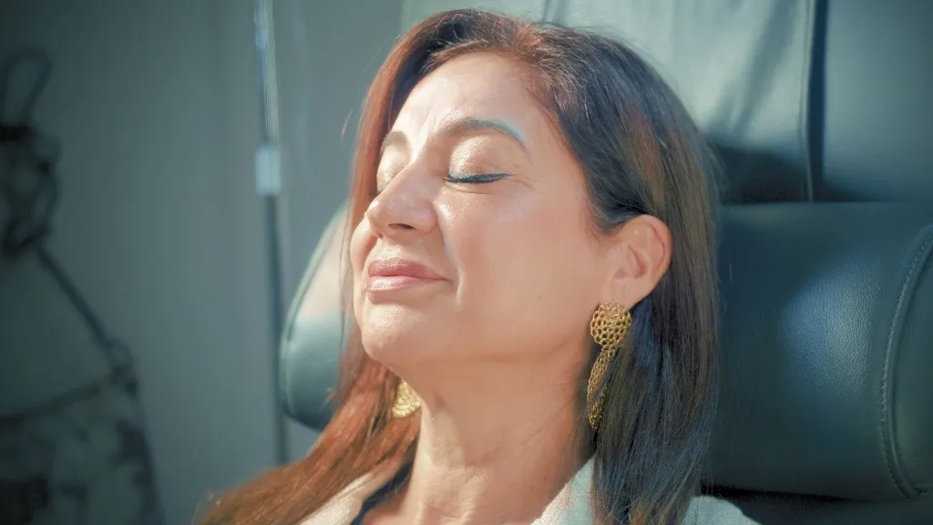 Woman relaxing in a treatment chair during a wellness visit