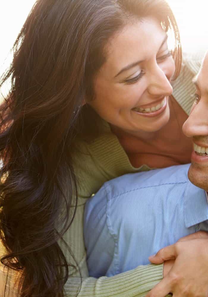 Loving Hispanic Couple In Countryside happy healthy couple on hormone therapy