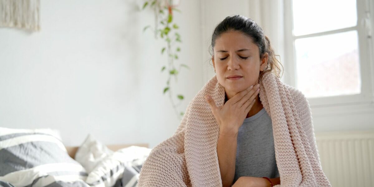 Woman with sore throat